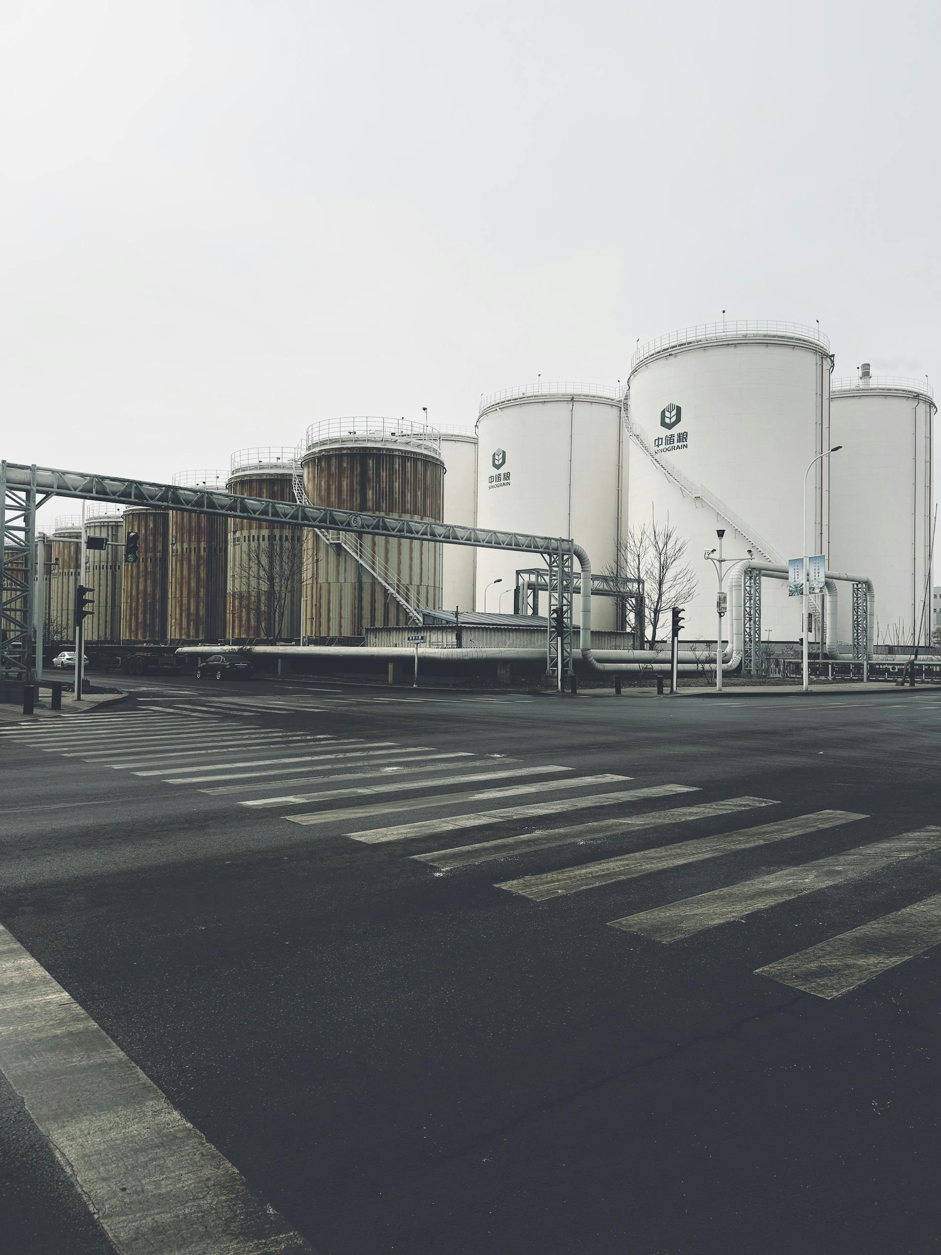 View of industrial silos and a crosswalk in Tianjin's Bin Hai Xin Qu district.